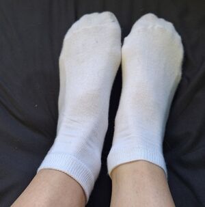 Well worn white women’s socks